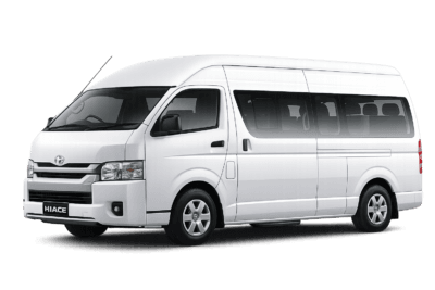 Toyota Hiace Commuter putih tampak serong depan dan samping untuk layanan sewa Hiace Jakarta dengan driver profesional